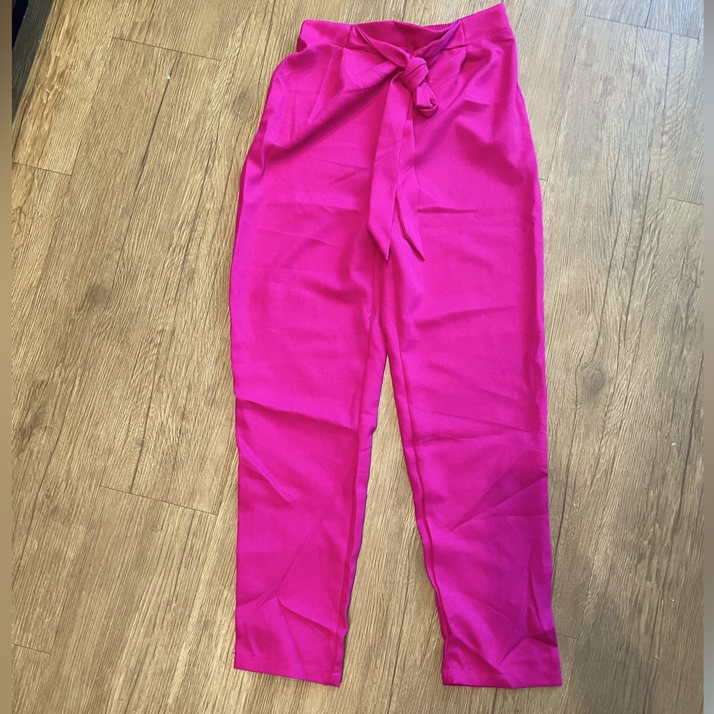 Pink, tied trousers. Never worn. Size M